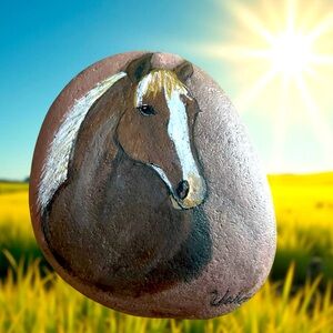 Hand crafted painted horse rock brown natural stone background black white 4x4